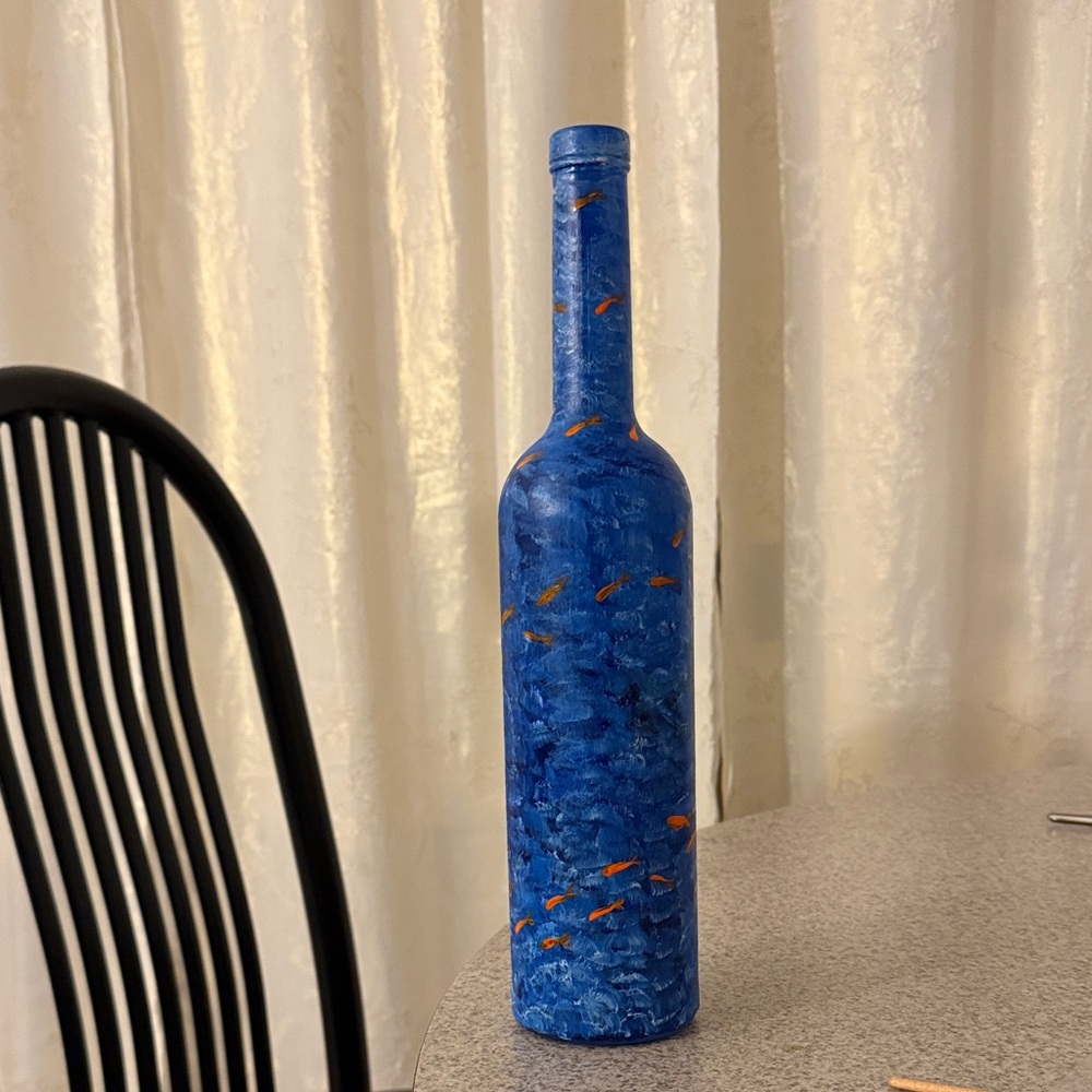 Blue Decorative Bottle with Orange Accents